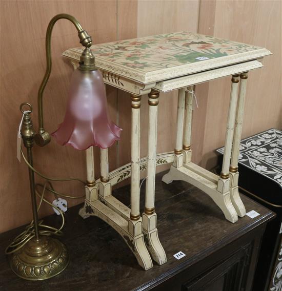 A painted nest of two tea tables (a.f.) and a brass table lamp W.48cm largest table